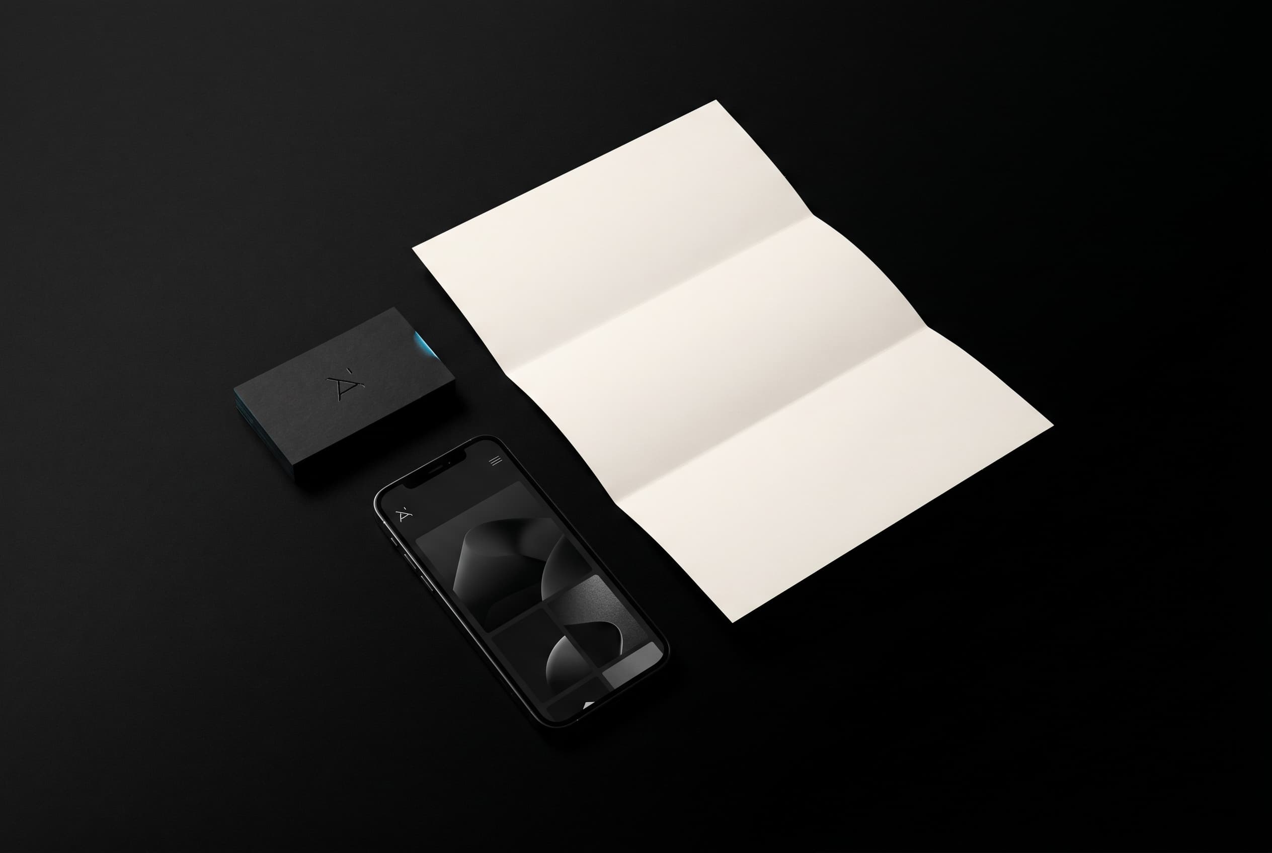 Quiet-luxury brand application: card, letterhead, and dark UI